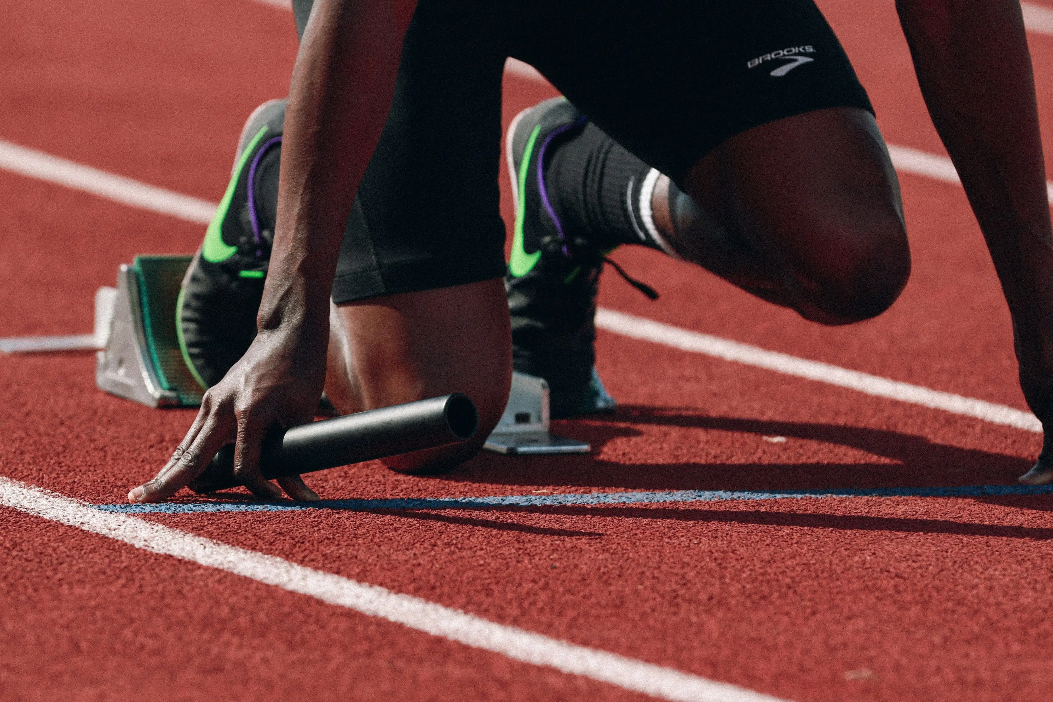 Athlete running on an athletics track